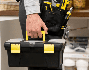 Plumber near me + plumber carrying toolbox, reliable plumbers in Burlington on site